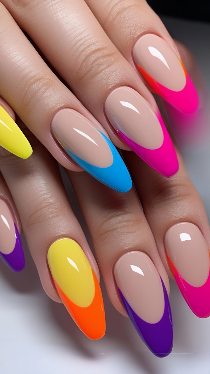 Almond-shaped nails with vibrant color-blocked French tips in yellow, blue, pink, orange, and purple over a netral base.