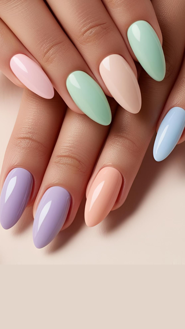 Almond-shaped nails with a glossy pastel rainbow palette including mint green, lavender, blush pink, baby blue, and peach.