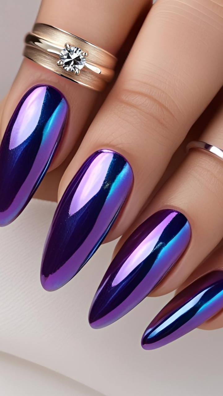 Magnetic cat eye nails with a chrome finish in vibrant blue and purple hues.