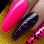 Coffin nail art featuring neon pink, black glitter, and animal print design